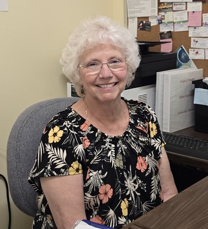 A Project Timothy volunteer sitting with a neighbor to listen and offer help